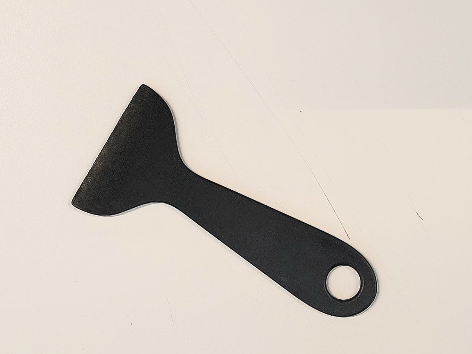 Plastic spatula for removing the prints. 